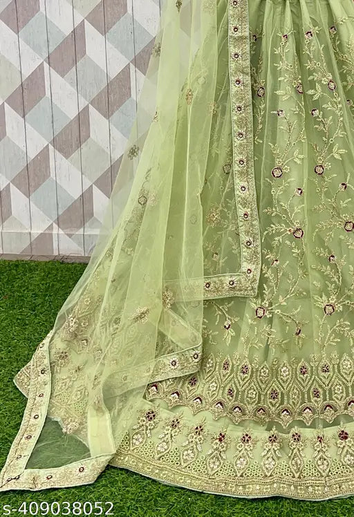 Heavy embroidered Indian wedding lehenga choli set in net fabric, perfect for festivals and gatherings