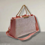 Pink leather crossbody sling bag with metal accents