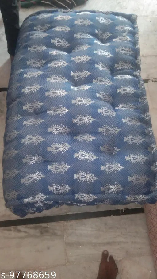 Blue and white quilt on display