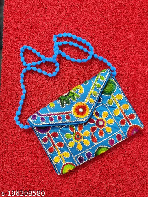Elegant blue and beige purse with floral design