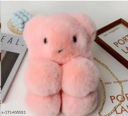Pink fuzzy teddy bear plush bag with a bow on top