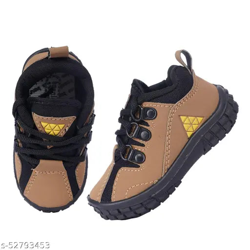 Black, white, and yellow athletic shoes for kids