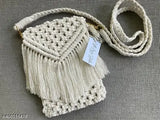 Handmade macrame mobile sling bag, cross body style, for women and girls. Soft beige with fringe detail, size 75 inches
