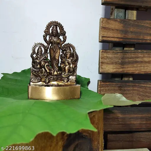 Metal Laxmi Ganesha Saraswati idol, intricately-detailed Indian figurine of Laxmi, Ganesha, and Saraswati, stands at 11cm tall
