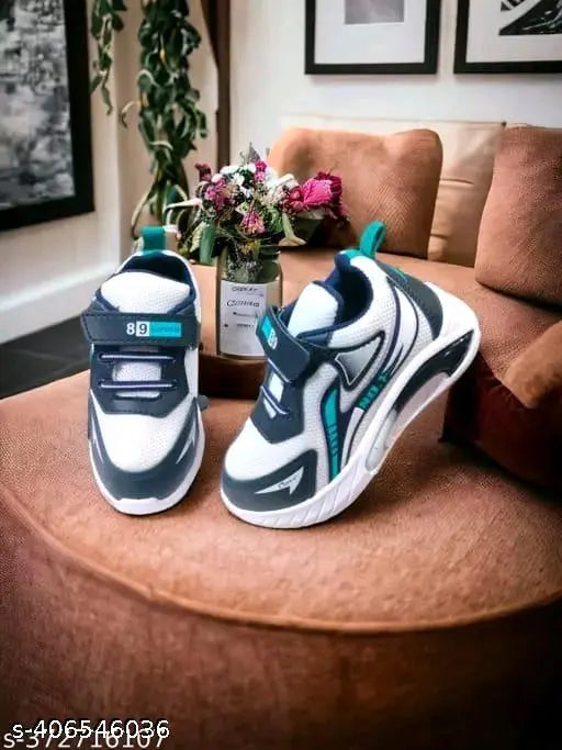 Pair of blue and white PVC casual shoes with silver buckles