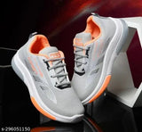 Grey and orange unisex kids walking shoes, designed with supportive cushioning and breathable mesh paneling, suitable for school and outdoor activities