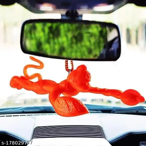 Orange plastic religious idol: Flying Lord Hanuman showpiece by AKSMIT