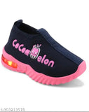 Kids' sports shoes with led lights and pink lettering