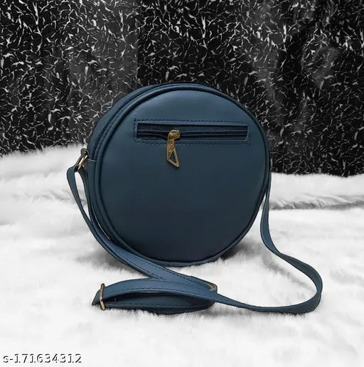 Blue leather round clutch with a small strap