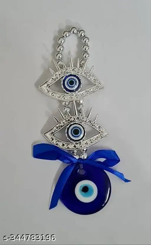 Silver and blue Turkish Evil Eye Feng Shui Wall Hanging, enhances harmony and peace in home decor or car. Protects against bad omens with blue amulet and bead work detailing