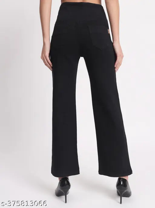 Solid black denim jeggings with high waist elastic closure for women, size 28, on model
