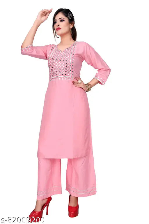 Rayon embroidered mirror work kurta and palazzo set with round neck, 3/4 sleeves, side slits. Beautiful Indian traditional women's clothing on display