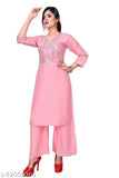 Rayon embroidered mirror work kurta and palazzo set with round neck, 3/4 sleeves, side slits. Beautiful Indian traditional women's clothing on display
