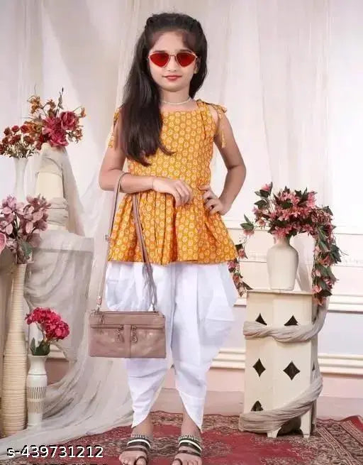 Yellow crepe dhoti and top, printed top with solid bottom for kids aged 3-4 years, traditional Indian attire on display