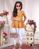 Yellow crepe dhoti and top, printed top with solid bottom for kids aged 3-4 years, traditional Indian attire on display