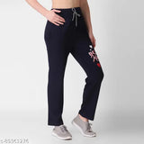 Black cotton sweatpants with a white heart logo