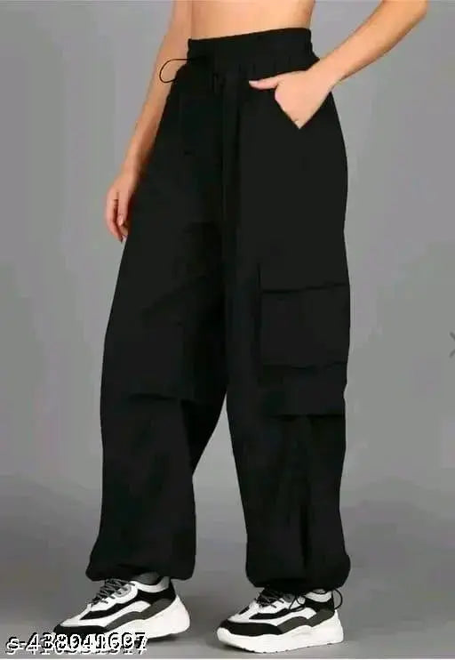 Black polyester women's jogger pants, stylish and comfortable, high-rise with four pockets, slanted side pocket, and flap details