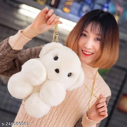 Fur-lined handbag with a fluffy teddy bear on a chain