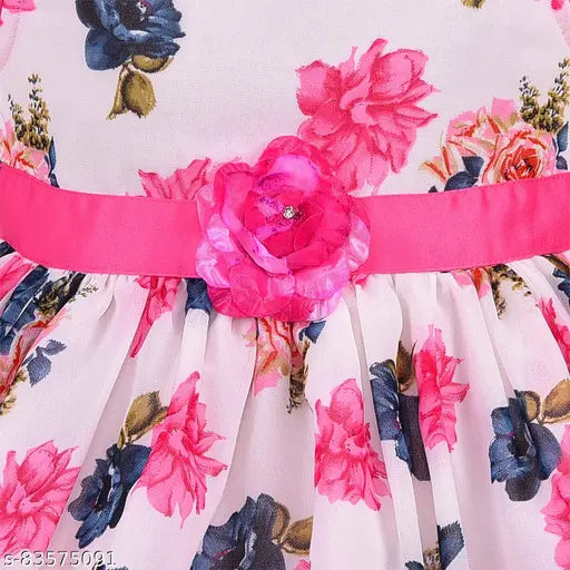 Silver and pink floral pattern baby girl knee length dress with a ruffled pink flower accent and a matching pink belt