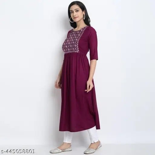 Rayon embroidered A-line kurta, solid combo, three-quarter sleeves. Indian women's fashion on model