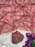 Purple georgette saree with intricate white and pink floral embroidery, sheer lace borders, floor length