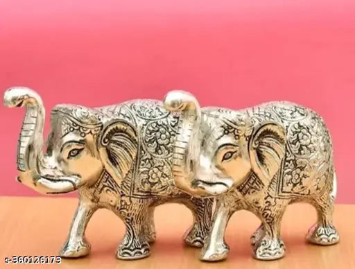 Silver plated metal elephant pair for Indian puja and Diwali decor, set of 2 with a total height of 10 cm and breadth of 16 cm