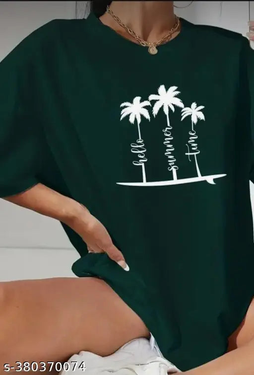 Over size tee shirt, black and white graphic design on a green shirt