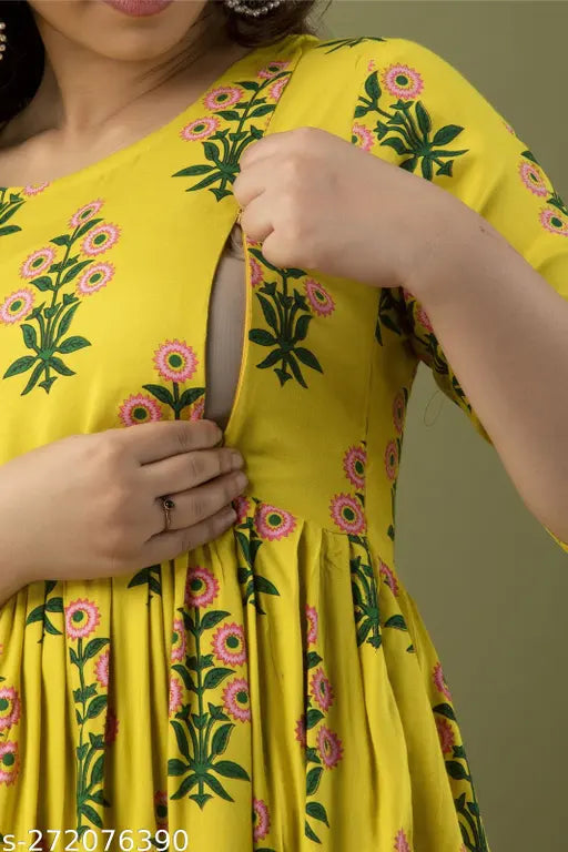 The image is of a yellow blouse with floral detailing and a zipper, worn by a person whose hands are on their hips