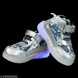 Silver lace-up kids shoes with glowing LED lights on feet