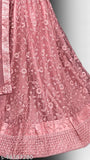 Designer pink net lehenga with embroidery work, unstitched blouse piece, and matching dupatta - ideal for parties or festivals