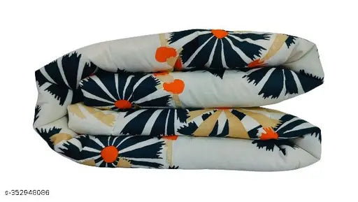 Multi-colored cotton baby quilt from Taj Overseas, ideal for mild winter and crib use. Hand washable with polyfill filling