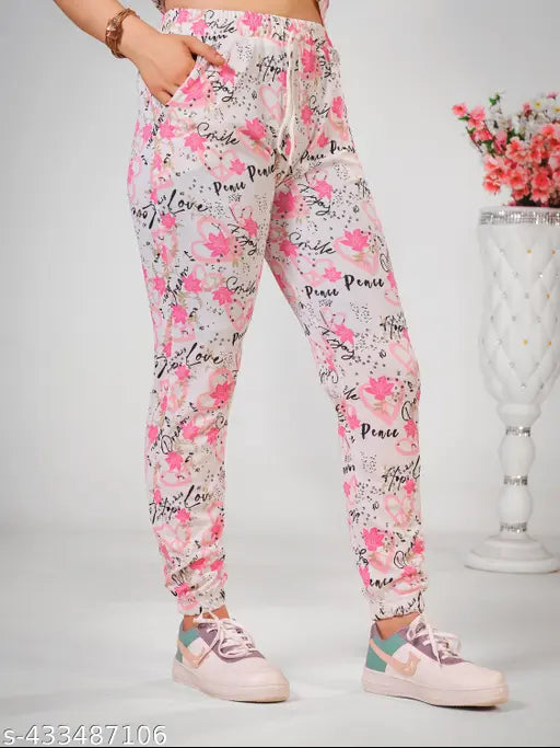 Pink printed cotton blend night suit set with ankle-length bottoms, side pockets, and drawstring waist. Versatile for sleep, lounge, travel, yoga, gym, or parties. Made in India