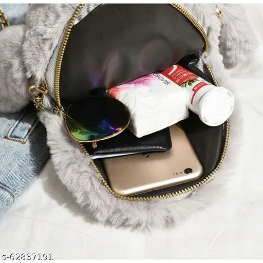 Black fur flap bag with phone, wallet, and makeup