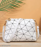 White and black polka dot sling bag, perfect for everyday outings