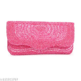 Hot pink designer fabric clutch with a rectangular shape and embellishments