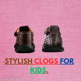Style of kids' shoes. This is a pair of lightweight, light brown casual sandals for boys and girls, featuring closed toes and an open-back design. They appear comfortable and suitable for walking and running in a variety of settings