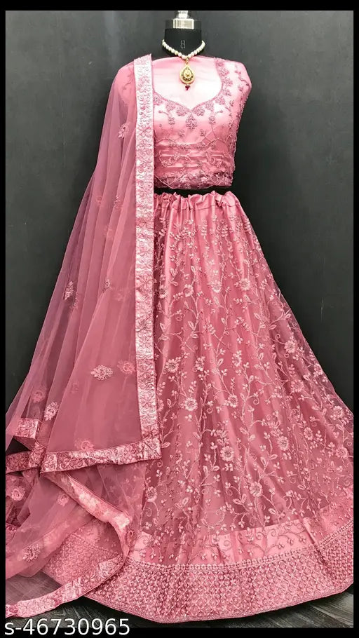 Elegant pink net semi-stitched Lehenga Choli with extra inner and dupatta, ideal for weddings, festivals, parties. Embroidered Indian bridalwear with heavy embroidery work, black and multi-color design