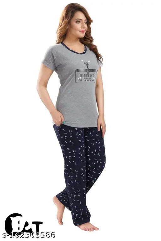 Grey cotton women's night suit set with half sleeve T-shirt and pajama pants, featuring printed design and elastic drawstring waist. Ideal for sleepwear and loungewear in a roomy fit. Made in India