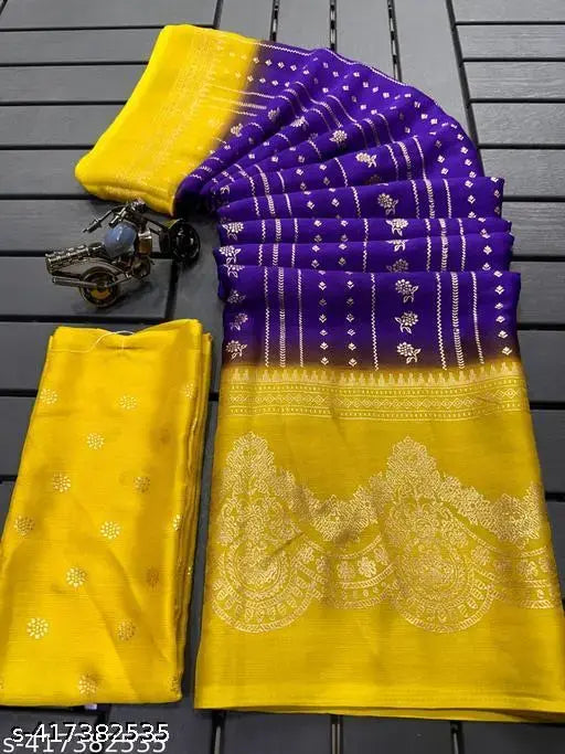 A yellow saree with full foil design, blue border, and a matching blouse