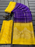A yellow saree with full foil design, blue border, and a matching blouse
