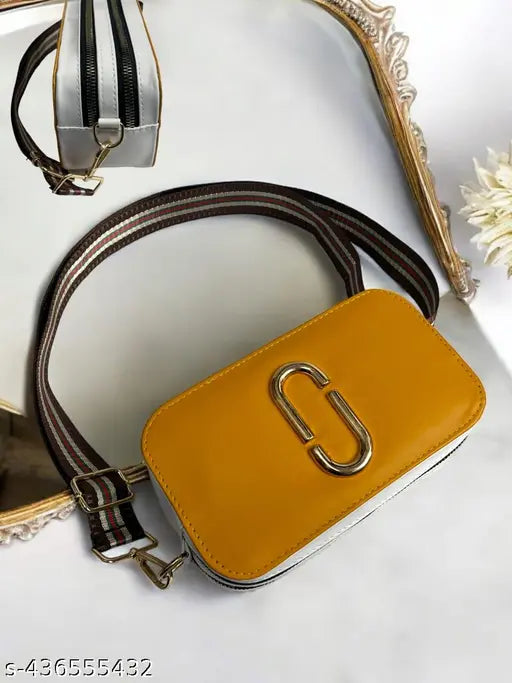 Yellow purse with a chain strap and silver hardware