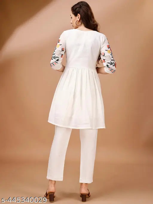 Off-white linen flared tunic & trouser coord set, three-quarter sleeves, intricate multi-thread embroidery, Indian handcrafted fashion