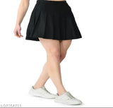 Solid polyester checked pleated mini tennis skirt with attached shorts for active women, high waist and above knee. Suitable for various sports activities or casual wear. Machine washable for easy care. Available sizes: 24/XS (Waist 24 in, Length 17 in), 26/S (Waist 26 in, Length 17 in), 28/M (Waist 28 in, Length 17 in), 30/L (Waist 30 in, Length 17 in), 32/XL (Waist 32 in, Length 17 in), 34/2XL (Waist 34 in, Length 18 in). Origin: India