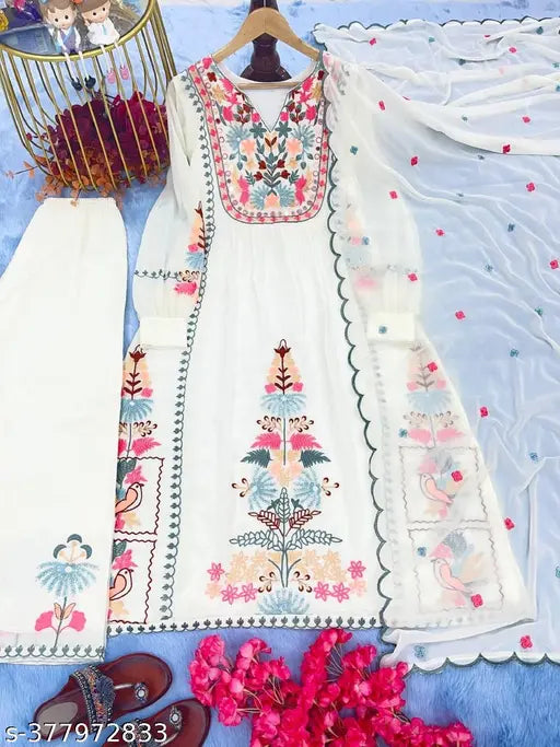 White Georgette Party Wear Look Top Plazzo & Dupatta Set with Embroidered Three-Quarter Sleeves, Rayon bottomwear, and heavy faux Georgette with Riyal mirror work. May show minor color variation due to screen lighting. Available in various sizes from S to XXL. Indian origin
