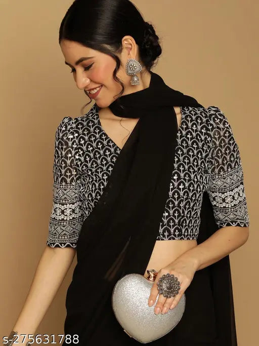 Plain georgette saree with Schiffli embroidery blouse, black and white embellishment