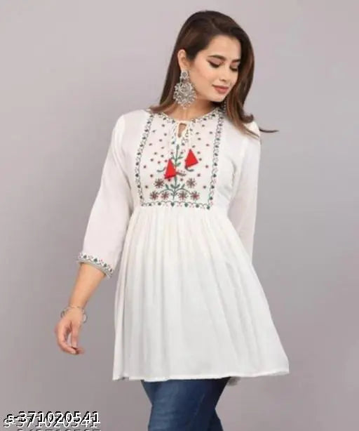 White embroidered kameez with long sleeves and round neckline