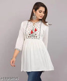 White embroidered kameez with long sleeves and round neckline