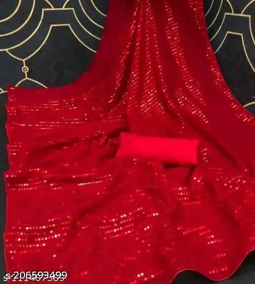A red, sparkling bridal saree with intricate detailing, displayed against a black background