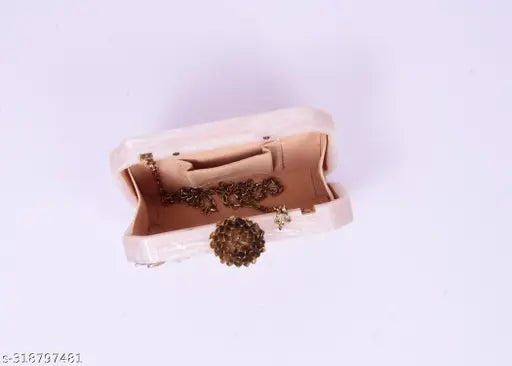 The image features a fashionable resin clutch bag by a designer, suitable for weddings or casual parties. It has a unique pattern and is handmade with embroidery details. The clutch is resin-based and appears to be a small-sized purse for women