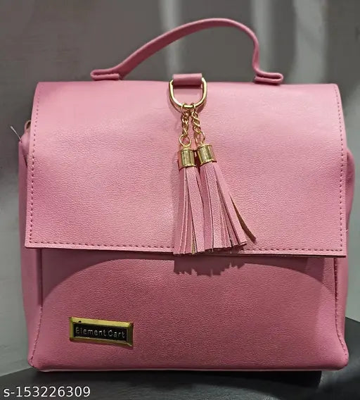 Hot pink faux leather shoulder bag with gold chain tassels